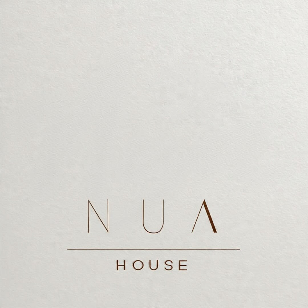 NUA House minimalist embossed logo