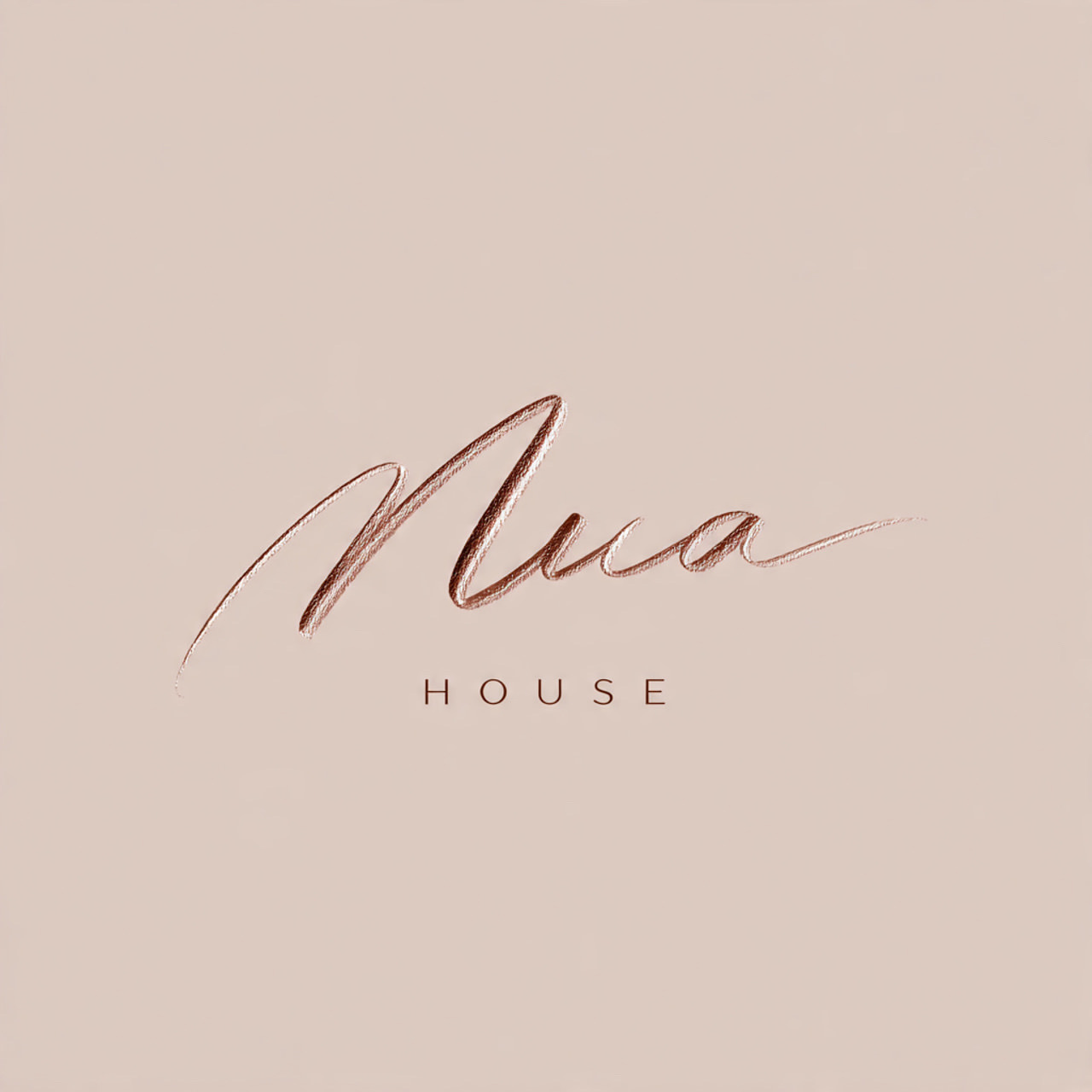 NUA House rose gold script logo detail